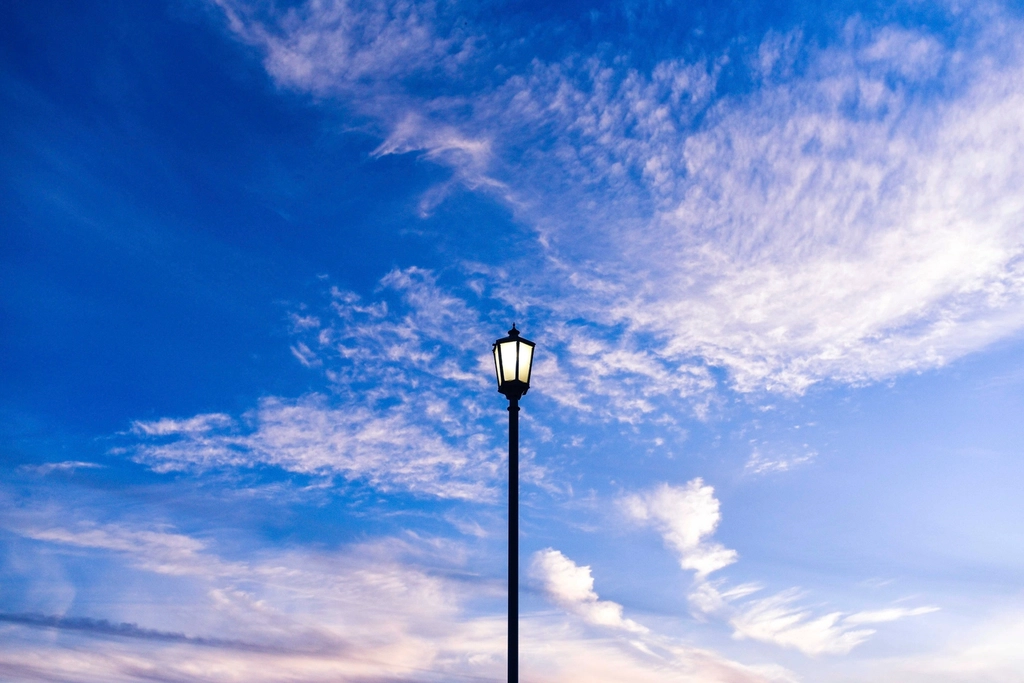 Blue sky background, light pole